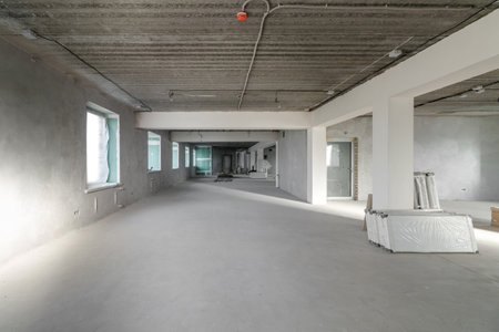 Spacious empty rooms in the attic floor after filling out the work on the wall and ceiling.の写真素材