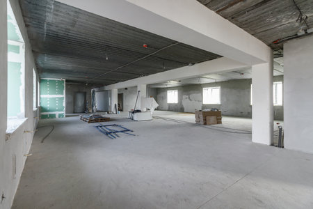Spacious empty rooms in the attic floor after filling out the work on the wall and ceiling.の写真素材