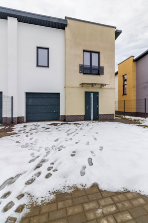 houses in residential community after snow in winter.の写真素材