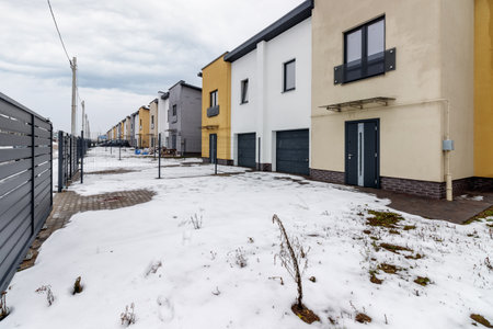 houses in residential community after snow in winter.の写真素材