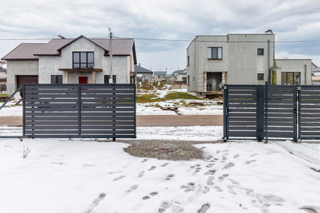 houses in residential community after snow in winter.