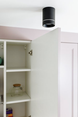 GRODNO, BELARUS - JUNE, 2022: Kitchen furniture in a modern style in a new apartment with a dining tableの写真素材