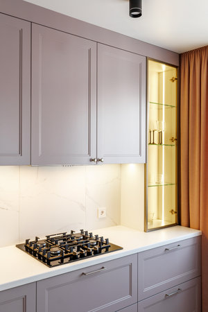 Kitchen furniture in a modern style in a new apartment with a dining tableの写真素材