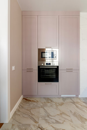 Kitchen furniture in a modern style in a new apartment with a dining tableの写真素材
