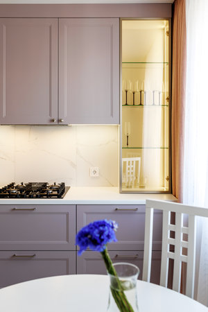 Kitchen furniture in a modern style in a new apartment with a dining tableの写真素材
