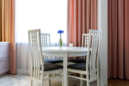 Kitchen furniture in a modern style in a new apartment with a dining tableの写真素材