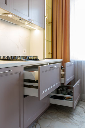 Kitchen furniture in a modern style in a new apartment with a dining tableの写真素材