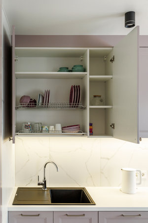Kitchen furniture in a modern style in a new apartment with a dining tableの写真素材
