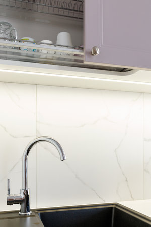 Kitchen furniture in a modern style in a new apartment with a dining tableの写真素材