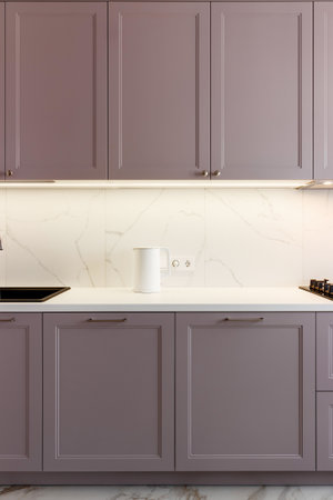 Kitchen furniture in a modern style in a new apartment with a dining tableの写真素材