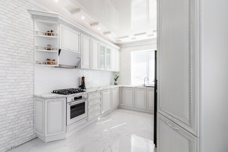 Modern interior with white kitchen and kitchen appliances in the country house.の写真素材