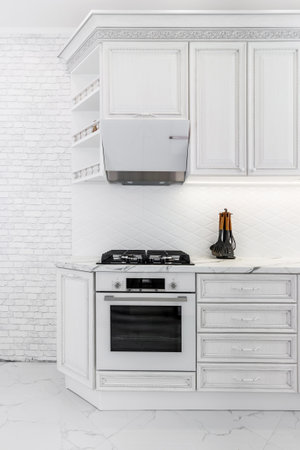 Modern interior with white kitchen and kitchen appliances in the country house.の写真素材