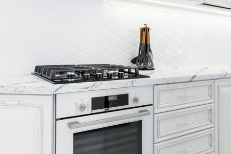 Modern interior with white kitchen and kitchen appliances in the country house.の写真素材