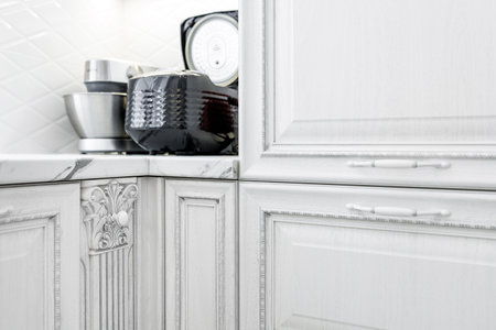 Decorative elements on the kitchen cabinets of the white modern kitchen.の写真素材