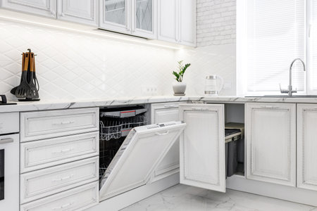 Modern interior with white kitchen and kitchen appliances in the country house.の写真素材