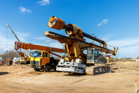 The construction site for the highway with heavy equipment. Two rotational exercises, lifting crane.の写真素材