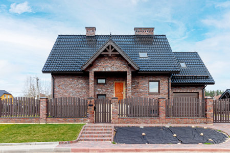 Fragment of a modern building lined with decorative bricks in the old style.の写真素材
