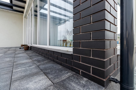 Fragment of a modern building lined with decorative bricks in the old style.の写真素材
