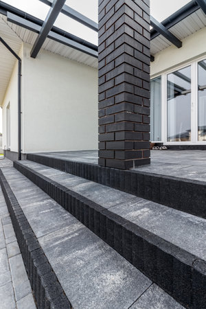 Fragment of a modern building lined with decorative bricks in the old style.の写真素材