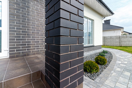 Fragment of a modern building lined with decorative bricks in the old style.の写真素材