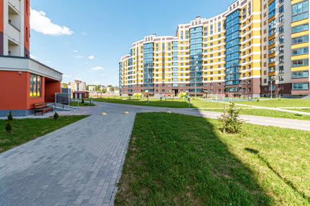 Courtyard with a children's playground near a multi-storey building.の写真素材