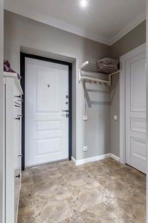 White entrance door inside an apartment in a modern interior.の写真素材