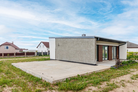 View of a small modern house immediately after construction. Step house construction system.の写真素材