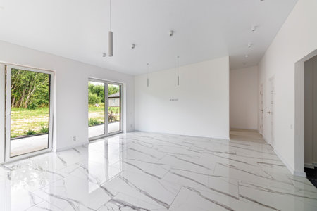 Interior of empty apartment, wide room with marble floorの写真素材