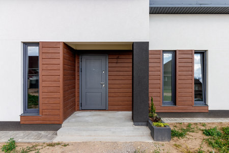 View of a small modern house immediately after construction. Step house construction systemの写真素材
