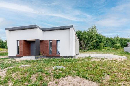 View of a small modern house immediately after construction. Step house construction systemの写真素材