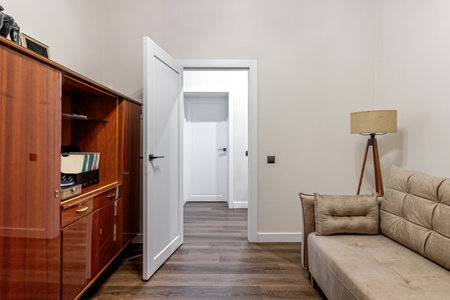 White modern interior door in an apartment with a simple interior.の写真素材