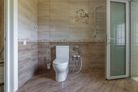 Interior of an unfinished bathroom with freshly laid ceramic tiles.の写真素材