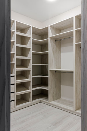 The interior of an empty dressing room is a lot of white shelvesの写真素材
