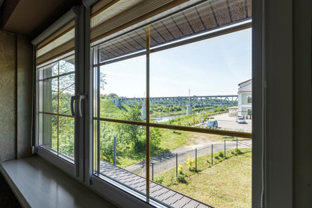 Window in the house with views of nature and the river in the summerの写真素材