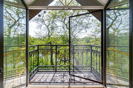 Window in the house with views of nature and the river in the summerの写真素材