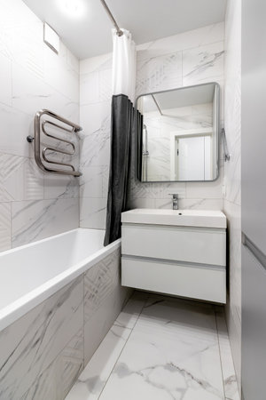 Modern bathroom in the apartment in gray and white colors.の写真素材