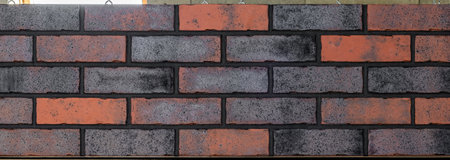 Close up of brick wall, example of facing material. Real photography.の写真素材