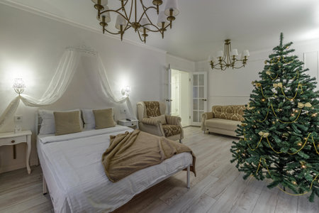 Nordic, cozy living room interior with a Christmas tree, white tones, coffee table, and sofa.の写真素材