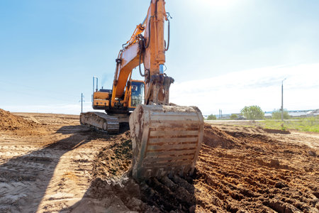 Yellow Excavator at Construction Site.の写真素材
