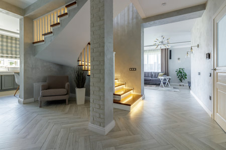 Bright modern home featuring an open layout, stylish staircase with LED lighting, cozy living area,...