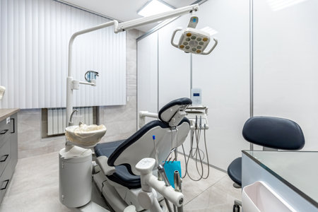 A modern dental clinic room equipped with advanced tools and technology for comprehensive oral care and treatment.の写真素材