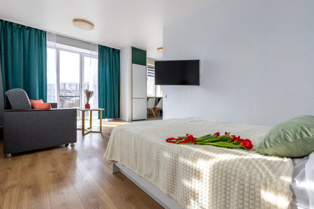 Bright Studio Apartment with Cozy Bedroom Areaの写真素材