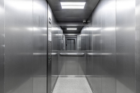 Sleek Steel Elevator Cabin with Mirrorの写真素材