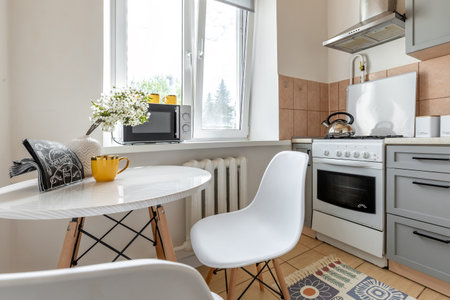 Cozy Kitchen Dining Nook with Modern Appliancesの写真素材