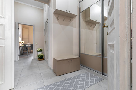 Modern Bright Hallway with Mirror Closet and Benchの写真素材