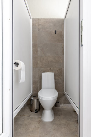 Minimalist public toilet interior in modern hostel or hotel