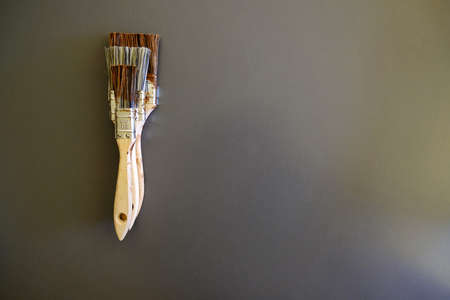 paintbrushes against gray background flatlay with copy spaceの写真素材