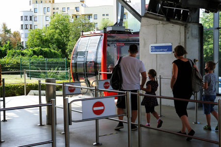 Wroclaw, Poland 08/24/2020 People entering the Polinka cable car which connects the Main University Campus with the Na Grobli Campus located on the other side of the river Odra.のeditorial素材