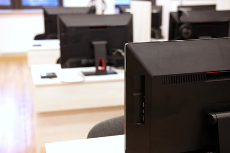 row of coputers in a modern IT classroom at universityの写真素材