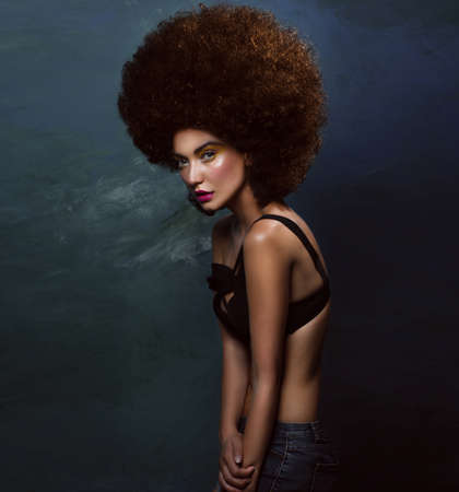 Girl in studio with an African hairstyleの写真素材